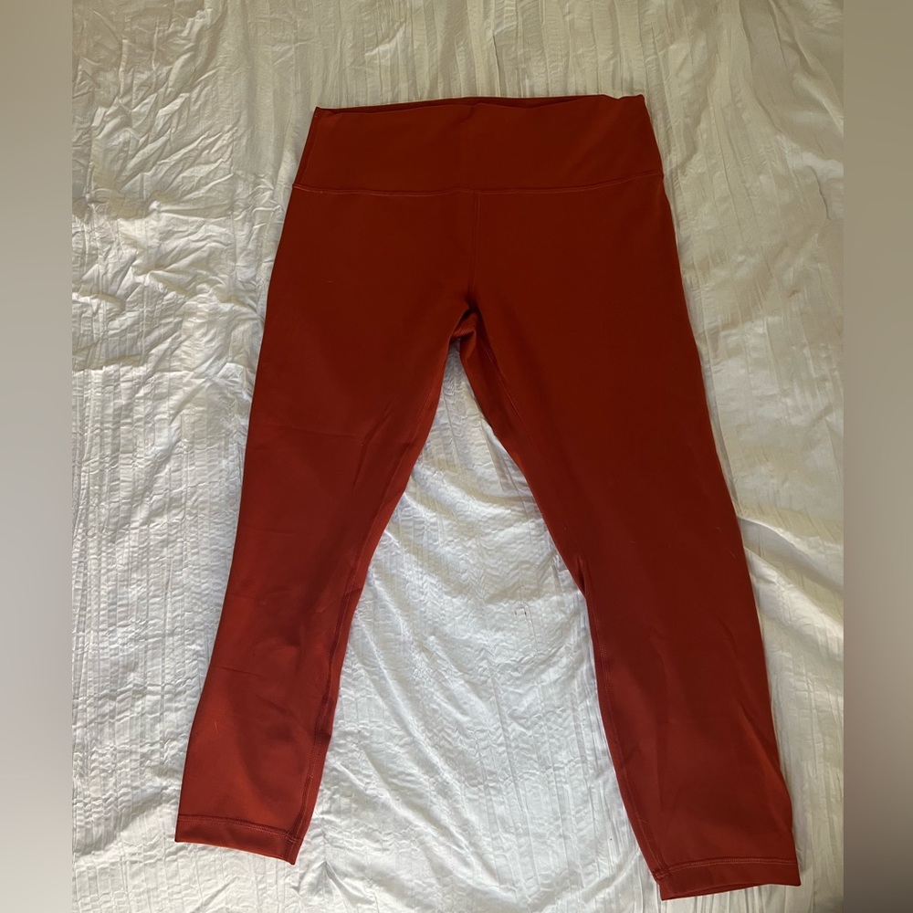 Dark orange Lululemon leggings EUC. No pilling between the legs. Only wore once